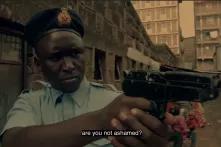 Video "Missing voices network Kenya". Policeman holding a gun.