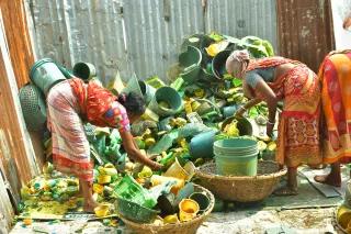 three women sorting plastic waste