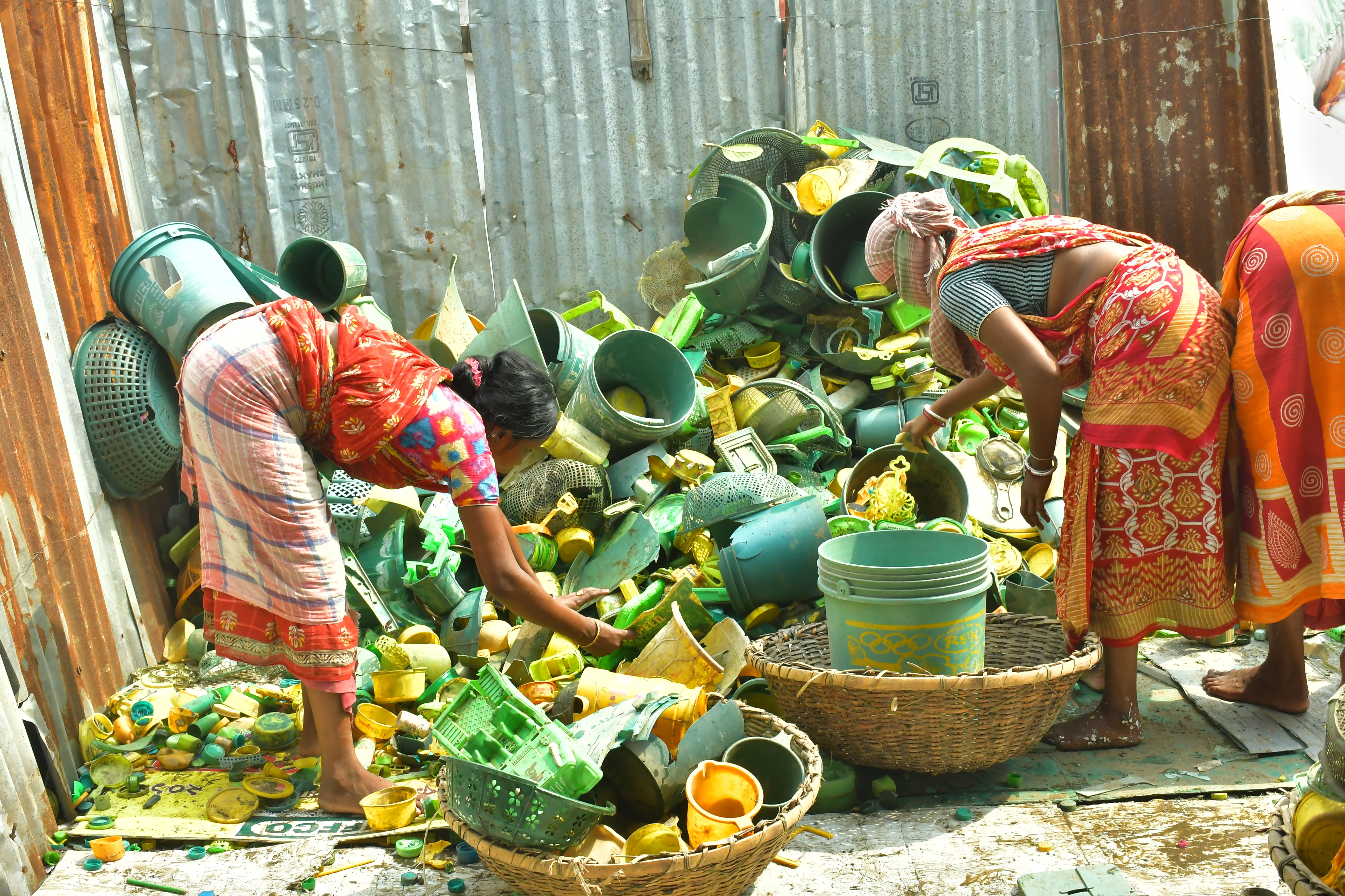 “Every day near Rampurhat, a city in West Bengal, people protect the environment by earning a living through collecting and recycling plastic waste.” - India (2020) three women sorting plastic waste