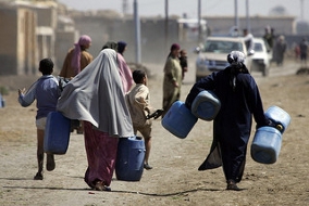 Women carrying water barrels in Egypt 2008