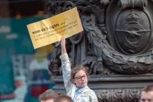 Little girl holds a sign about women rights