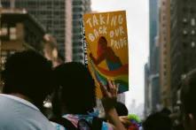 poster on demonstration saying "taking back our pride"