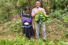 Woman and man with their harvested vegetables