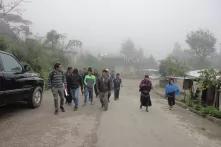Victor Santiz with people on a rural street