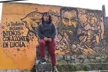 Yolanda Perez in front of a graffiti