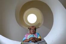 Abi Cris looking down from a staircase