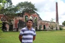 Cristian Sulub in front of an old house