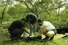Ha'kanules, three activists with water samples