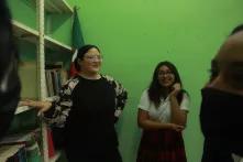 Gladys Pinto with students in school library