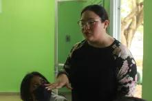 Gladys Pinto, explaning sth. at class