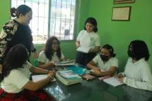 Gladys Pinto in class with students