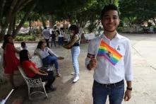 Joaquín Puerto with rainbow flag 