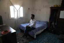Joaquín Puerto  in a small bedroom