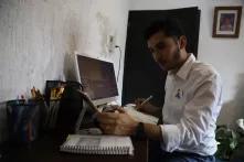 Joaquín Puerto working at a desk