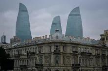 Buildings and a flame tower in Baku, Azerbaidschan