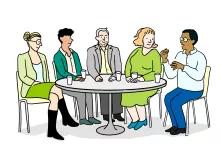 Gesprächsrunde - 5 Personen sitzen um einen runden Tisch