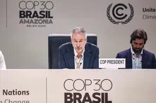 A man speaks as "COP President" at the COP30 climate conference in Belém, Brazil; another man with headset sits to his right.