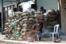 A barricade of sandbags at the roadside