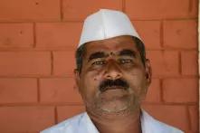 Farmer Pandurang Didhe with a white sailor's hat, which supporters of the Aam Aadmi Party also wear