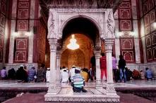 The little boy cheekily grabbed the best spot at Jama Masjid, India's largest mosque.