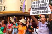 Women demonstrating in Brasilia. The message on the placard says: "The world isn't a commodity, so aren't women"