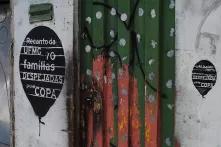 Graffitti on a house in Belo Horizonte displaying how many families lost their homes due to construction projects for the World Cup