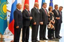 (From right to left)President of Kazakhstan Nursultan Nazarbayev, President Vladimir Putin, President of Belarus Alexander Lukashenko, President of Ukraine Petro Poroshenko, EU High Representative for Foreign Affairs and Security Policy Catherine Ashton, EU Commissioner for Energy Gunther Oettinger and EU Commissioner for Trade Karel De Gucht attend the meeting of the presidents of the Customs Union countries with the Ukrainian president and representatives of the European Commission in Minsk on August 26, 