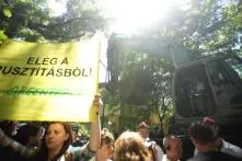 A group of protester with a banner Greenpeace in Hungary