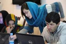 Young folks behind laptops