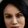 Portrait of Ana P. Santos. She is looking into the camera smiling.