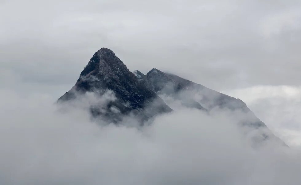 Climate Action Summit's pledges don’t square with what the science is telling us. Pledges that don't square - cloudy mountaintop