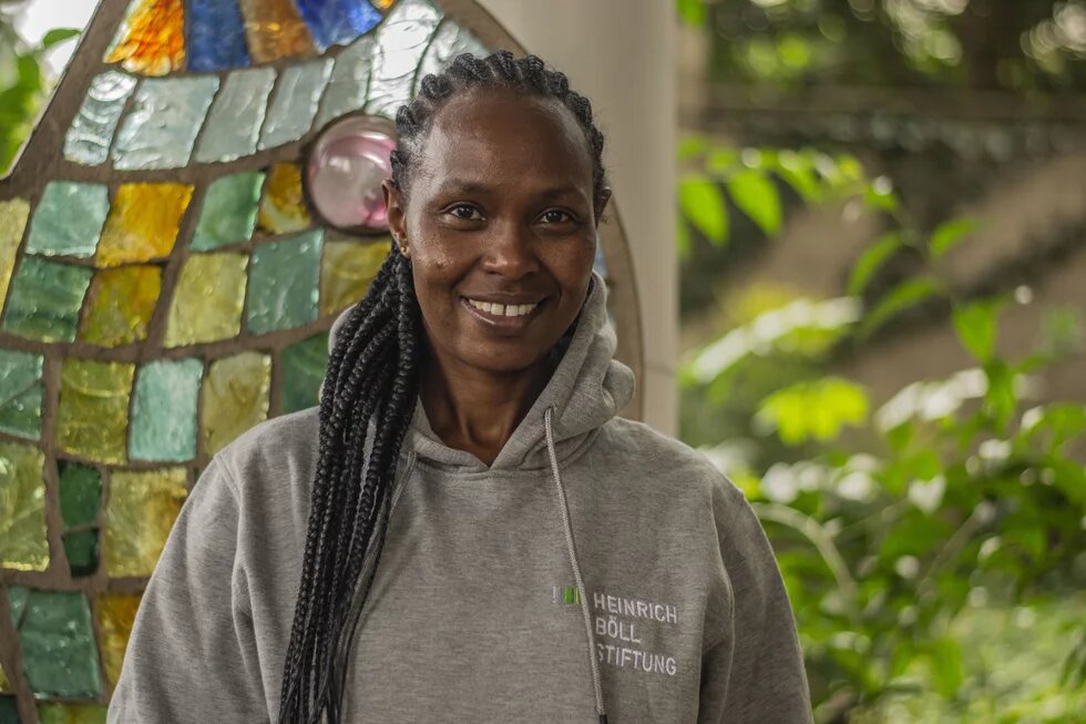 Evelyne Ogutu lächelt in die Kamera