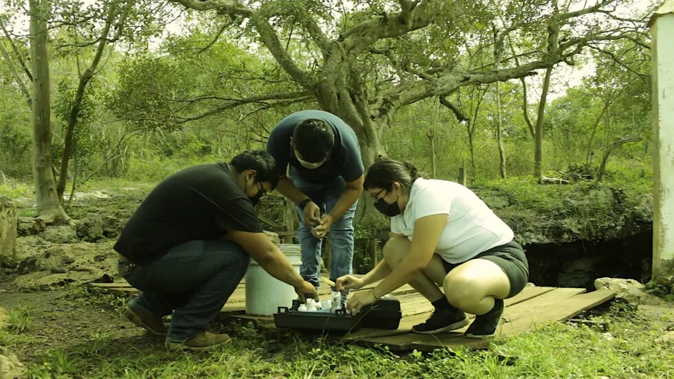 Ha'kanules, three activists with water samples Ha'kanules, three activists with water samples