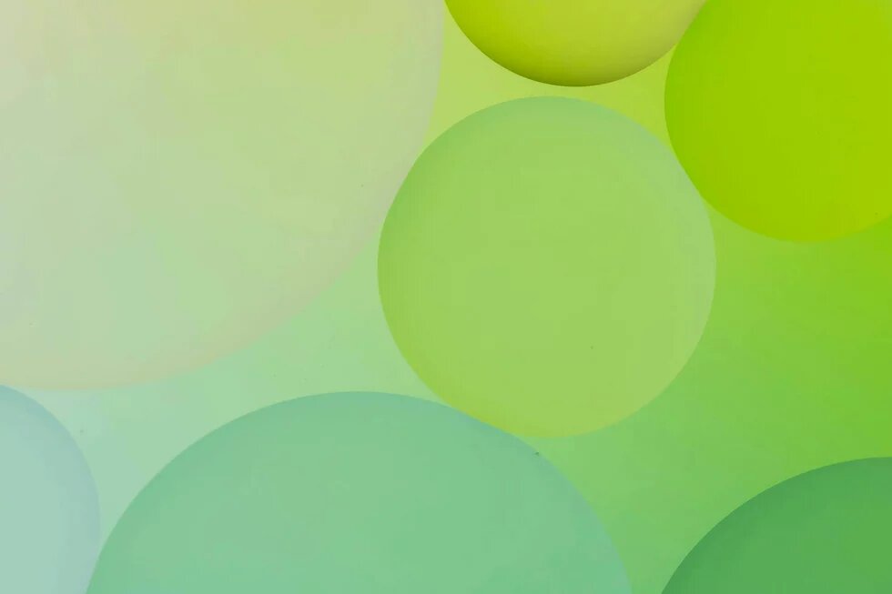 Illustration: Mehrere sich überlagernde grüne und blaue Kreise auf einem hellgrünen Hintergrund.