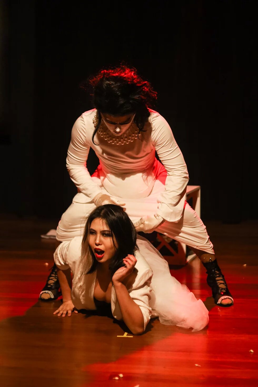 Photographs documenting the performance of Till Flesh Does Us Part, a piece that mixes ballroom dance, spoken word poetry and theatre, in collaboration with Amin Alifin (IG: @aminalifin), as part of Hantu Ballhaus performed in Centre 42, Singapore, 30 October 2024.