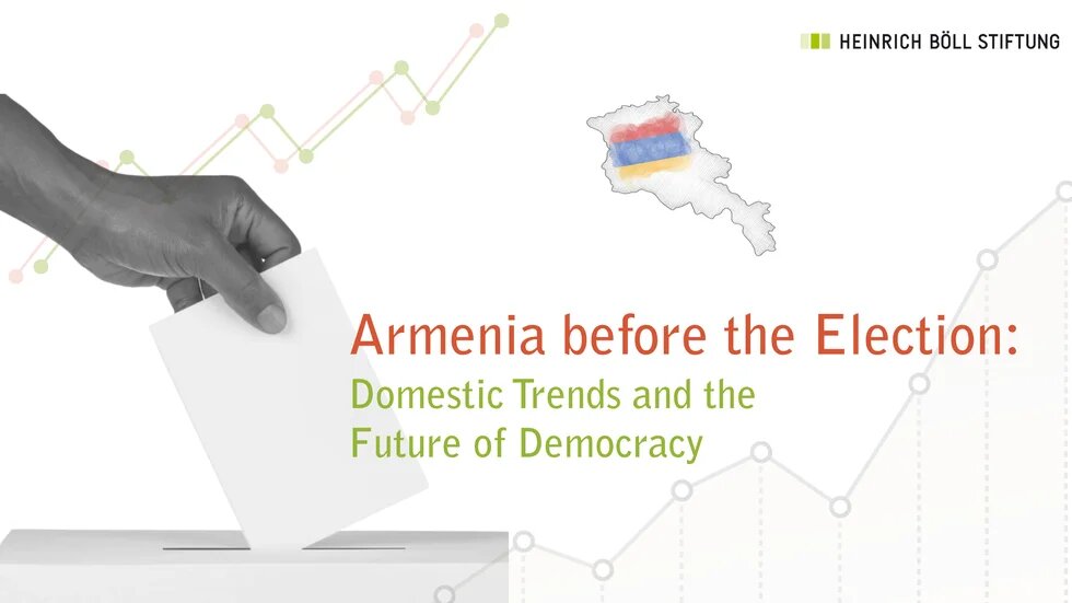 The picture shows a stilized hand putting a paper in a voting ballot.