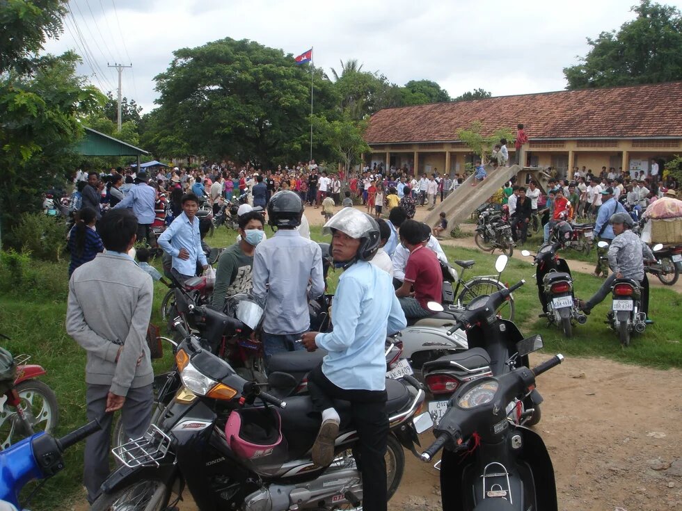 People gather in front of polling station 1204. They are protesting against alleged voter fraud.