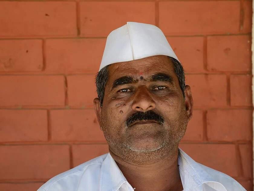 Farmer Pandurang Didhe with a white sailor's hat, which supporters of the Aam Aadmi Party also wear Farmer Pandurang Didhe with a white sailor's hat, which supporters of the Aam Aadmi Party also wear