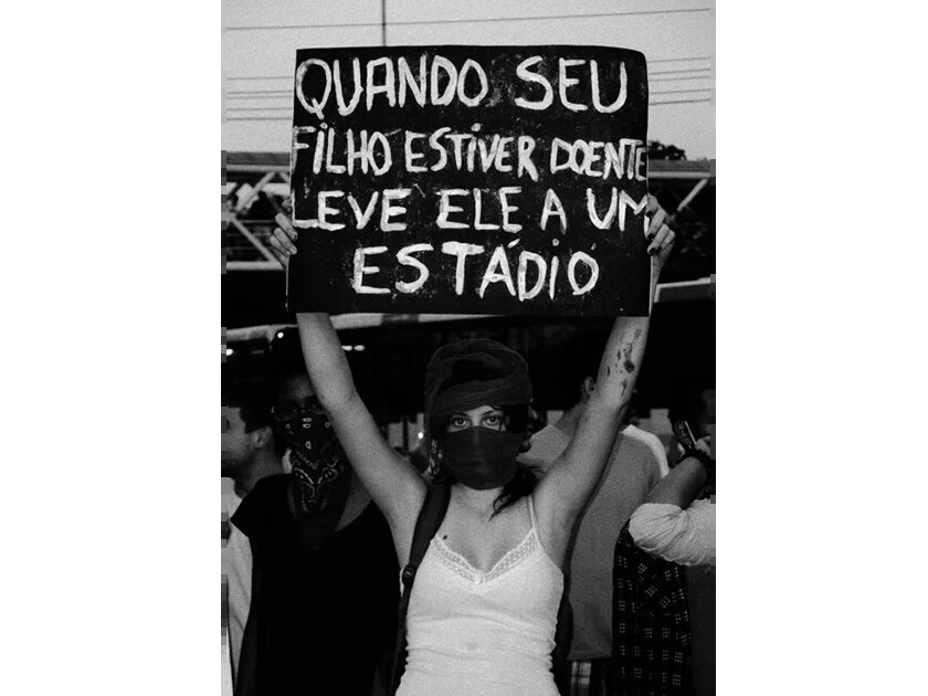 The sign says: "If your child is sick, take her/him to a stadium" The sign says: "If your child is sick, take her/him to a stadium"