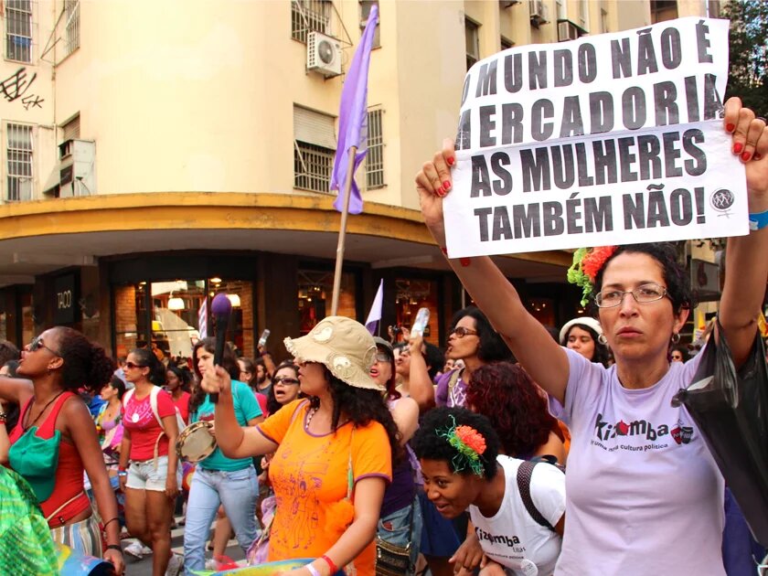 Women demonstrating in Brasilia. The message on the placard says: "The world isn't a commodity, so aren't women" Women demonstrating in Brasilia. The message on the placard says: "The world isn't a commodity, so aren't women"