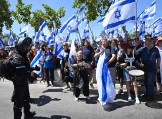 Israelis protesters hold Israeli flags and chant for democracy at a demonstration against Prime Minister Benjamin Netanyahu s judicial overhaul, outside the Supreme Court in Jerusalem, on Tuesday, July 11, 2023. Israelis protesters hold Israeli flags and chant for democracy at a demonstration against Prime Minister Benjamin Netanyahu s judicial overhaul, outside the Supreme Court in Jerusalem, on Tuesday, July 11, 2023.