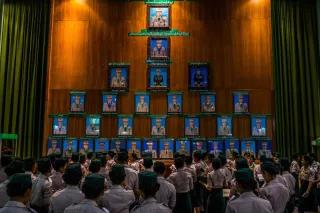 Min Aung Hlaing, the mastermind responsible for orchestrating the Myanmar coup, being accorded the highest honor within an exhibit showcasing portraits of military leaders at a museum located in Naypyidaw, the capital city. Women of the military in Myanmar