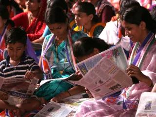 Election rally Indian voters read regional newspaperers at a MNS rally in Mumbai. Indian voters read regional newspapers at a MNS rally in Mumbai