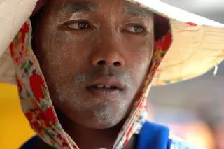 Burmese migrant working on a Thai boat, Samut Sakhon, Thailand