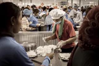 Garment workers receiving food during lunch time Cambodia Garment workers receiving food during lunch time Cambodia