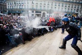 Riot Police assault on the Opera House Policeman uses pepper spray against protesters in France