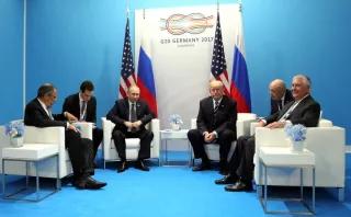 U.S. President Donald Trump, Russian President Vladimir Putin, Rex Tillerson, and Sergey Lavrov at the G20 Hamburg summit, 7 July 2017