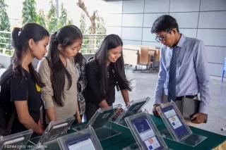 Khmer Rouge History Four girls looking at tablets to test the App "Khmer Rouge History"