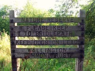Regulated destruction of biodiversity A sign in a nature reserve