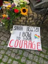 Photo by Tunay Altay from the vigil titled: “Sarah Hegazy: a vigil in mourning, a protest in her legacy!” (Berlin 2020), poster on the floor saying "Sarah Hegazi I bow to your courage" with candle and flowers